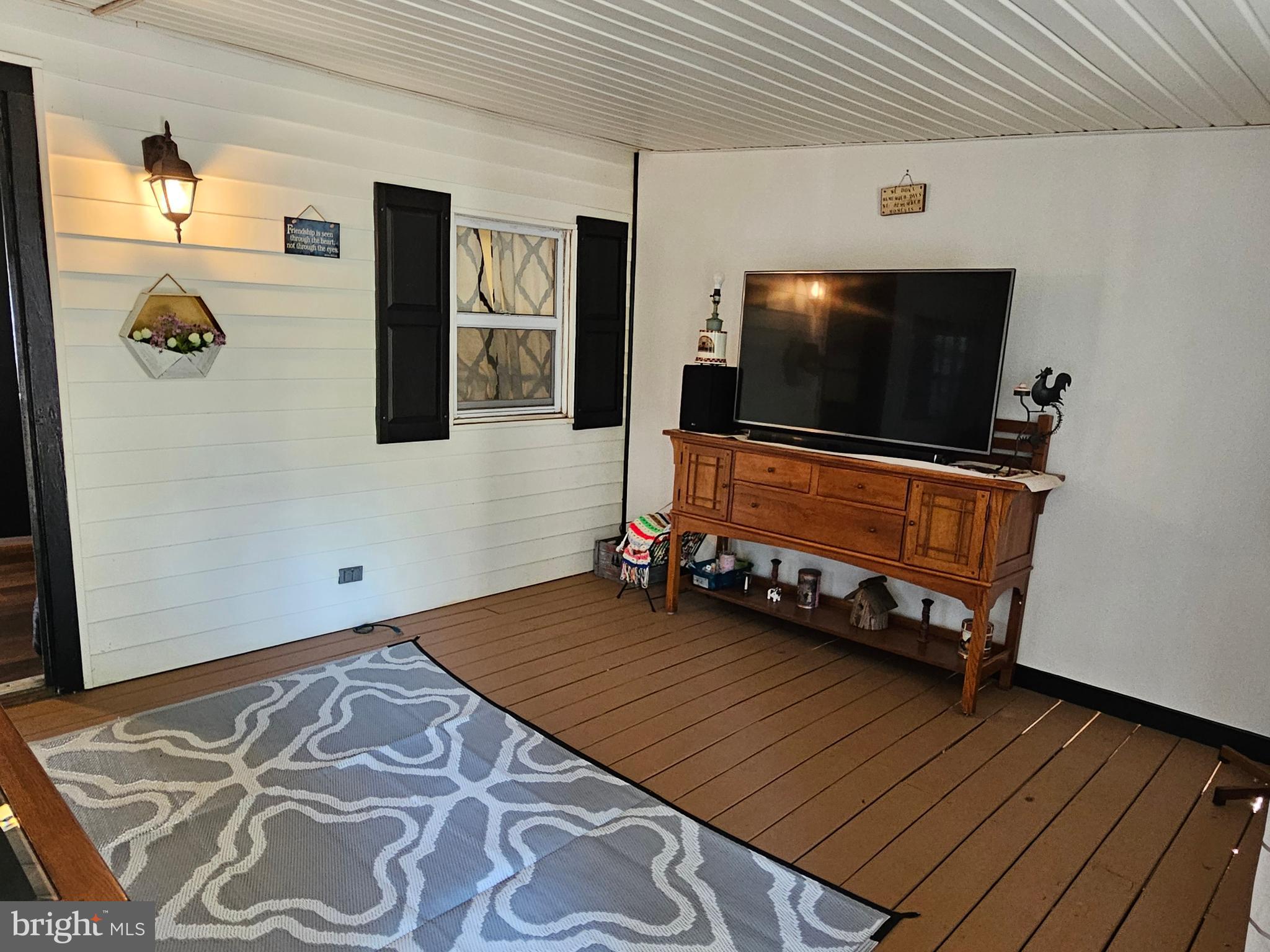 4 Old Faceful Street Falling Waters, WV 25419 - Photo 10 of 32 a living room with furniture and flat screen tv