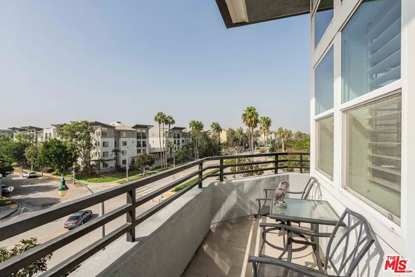 a view of balcony with furniture
