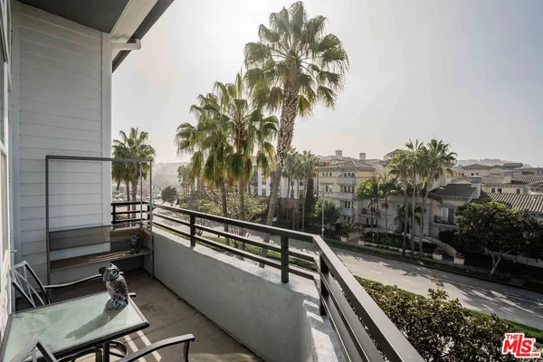 a view of balcony with furniture