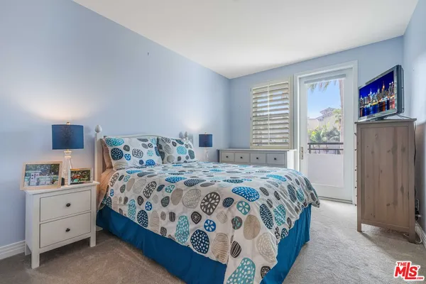 a bedroom with a bed and a cabinets