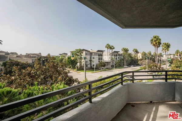 a view of a balcony with city view