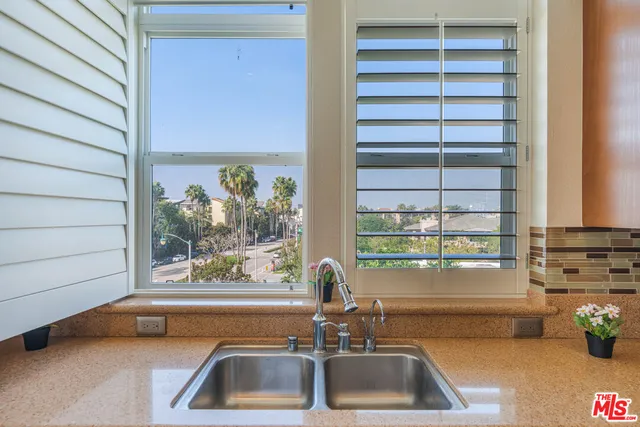 a bathroom with a sink and a window