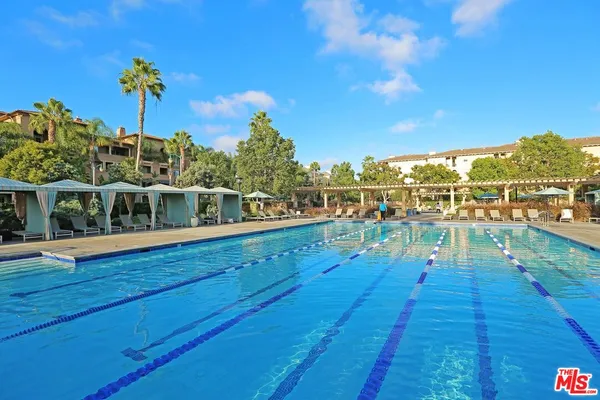 a view of a swimming pool with a patio