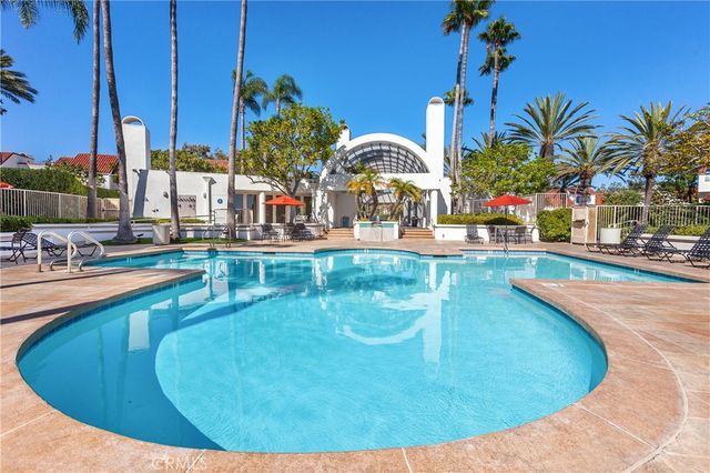 a view of a swimming pool with an outdoor seating