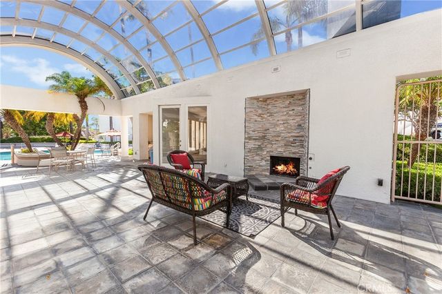 a outdoor living space with patio furniture and a fireplace