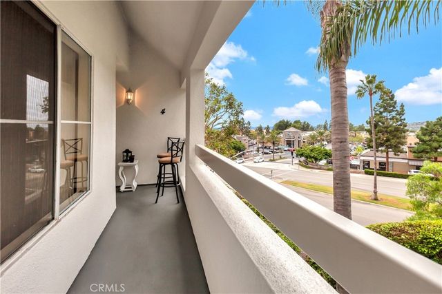 a view of balcony with two chairs and a table