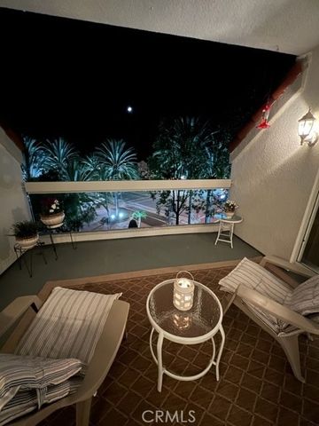 a view of a swimming pool with outdoor seating