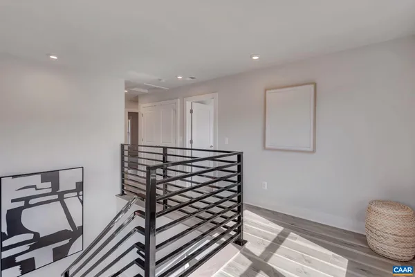 a view of an entryway with wooden floor