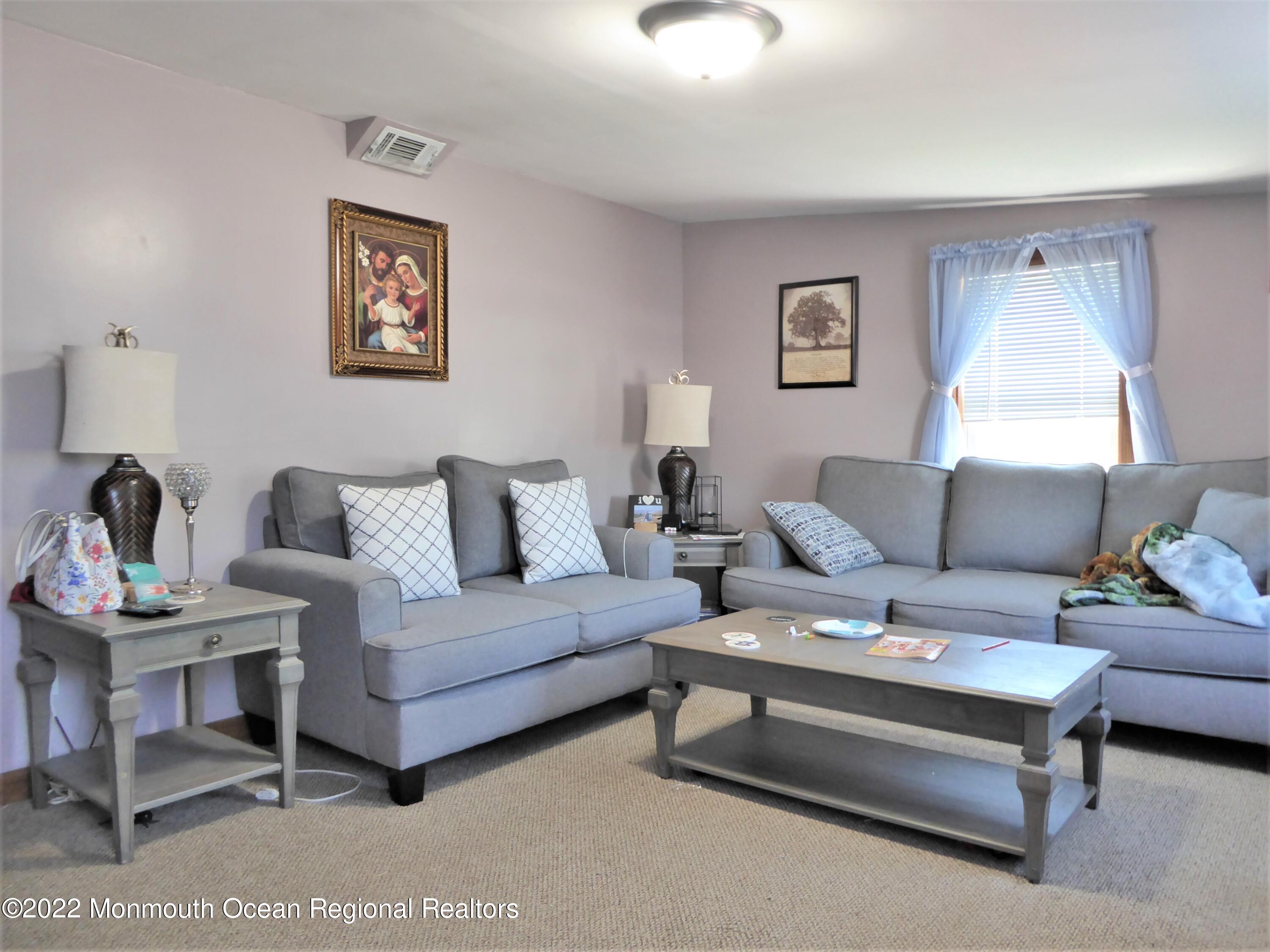 22 Main Street Cream Ridge, NJ 08514 - Photo 13 of 21 a living room with furniture and a lamp