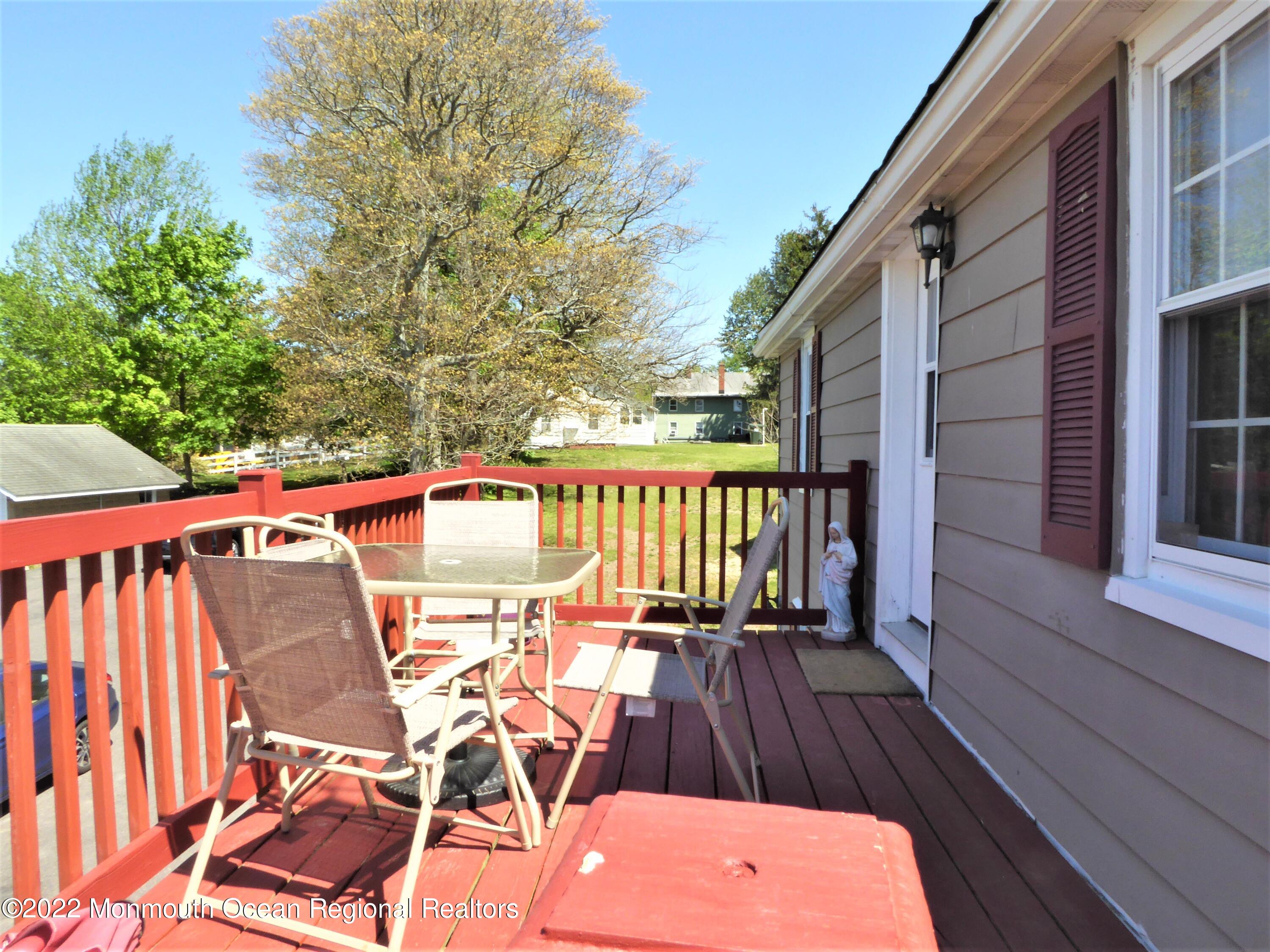 22 Main Street Cream Ridge, NJ 08514 - Photo 20 of 21 a view of a deck with wooden floor and outdoor seating