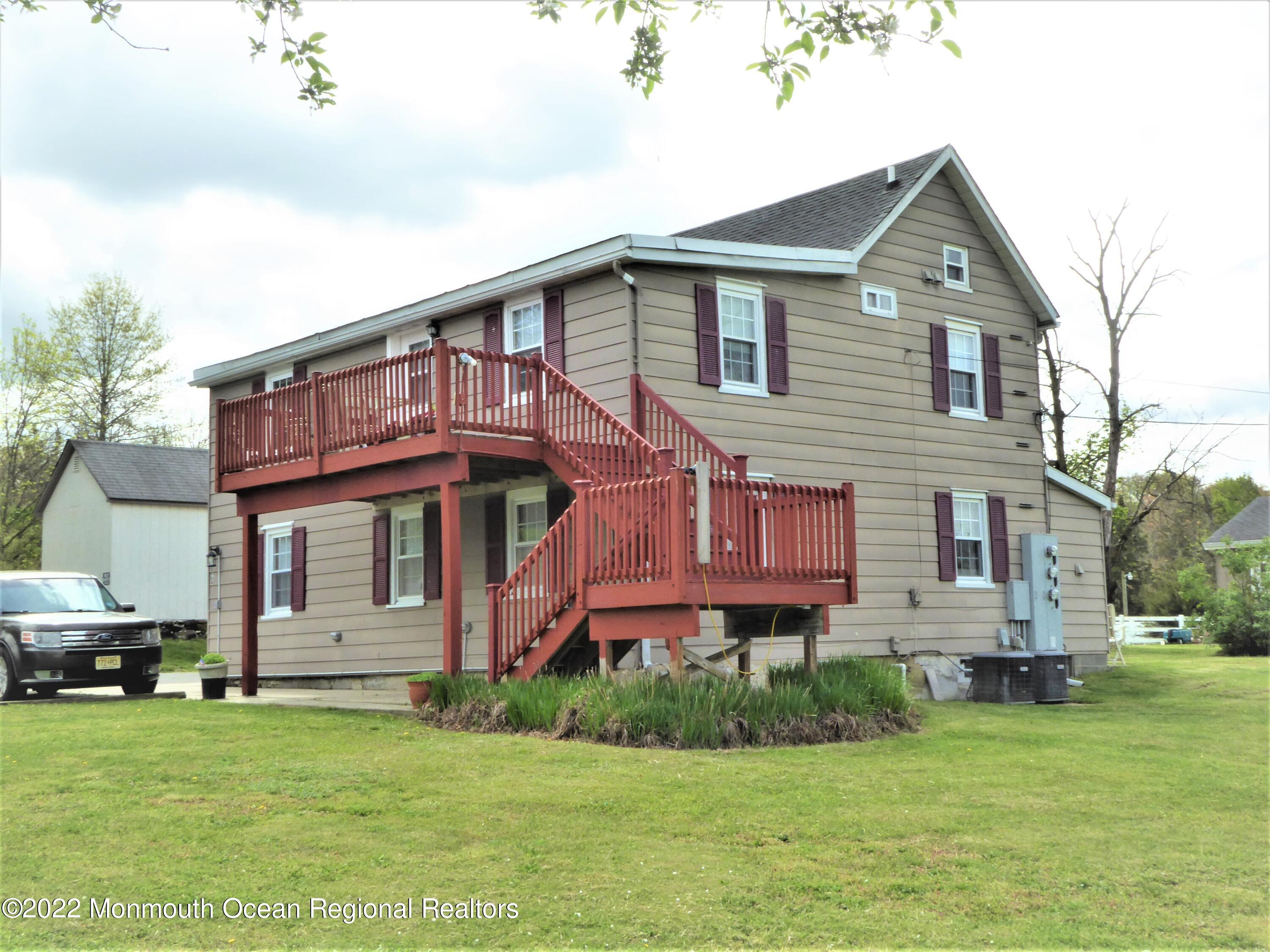22 Main Street Cream Ridge, NJ 08514 - Photo 9 of 21 a front view of a house with a garden