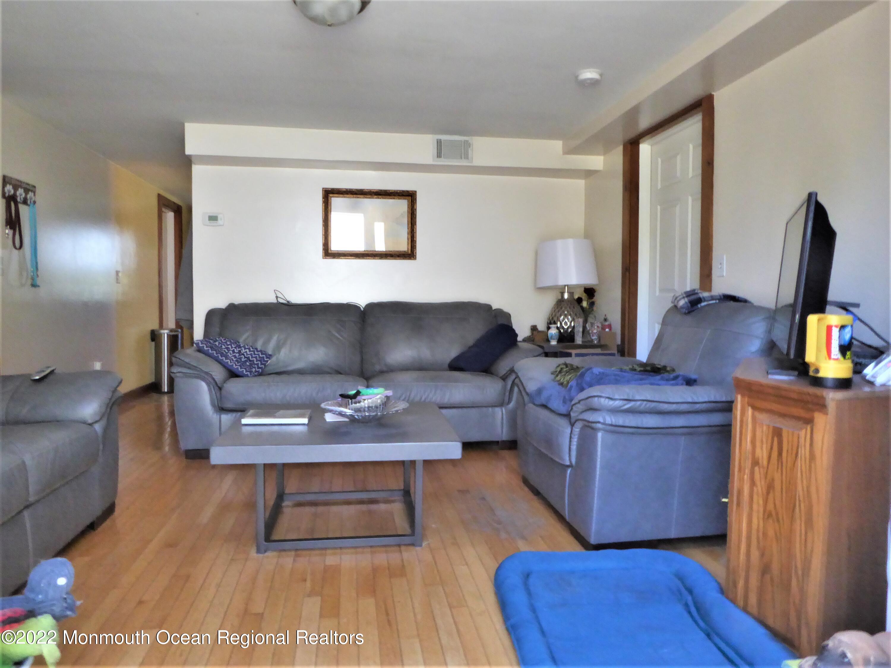 22 Main Street Cream Ridge, NJ 08514 - Photo 10 of 21 a living room with furniture and a flat screen tv