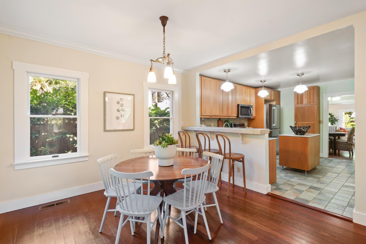 151 Melville Avenue Palo Alto, CA 94301 - Photo 17 of 51 a view of a dining room with furniture window and wooden floor