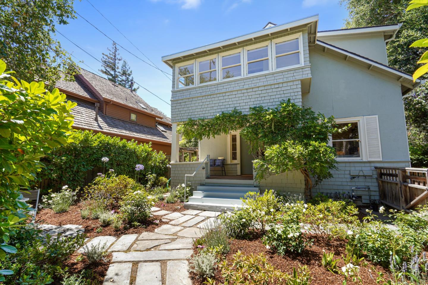 151 Melville Avenue Palo Alto, CA 94301 - Photo 2 of 51 a front view of a house with a yard