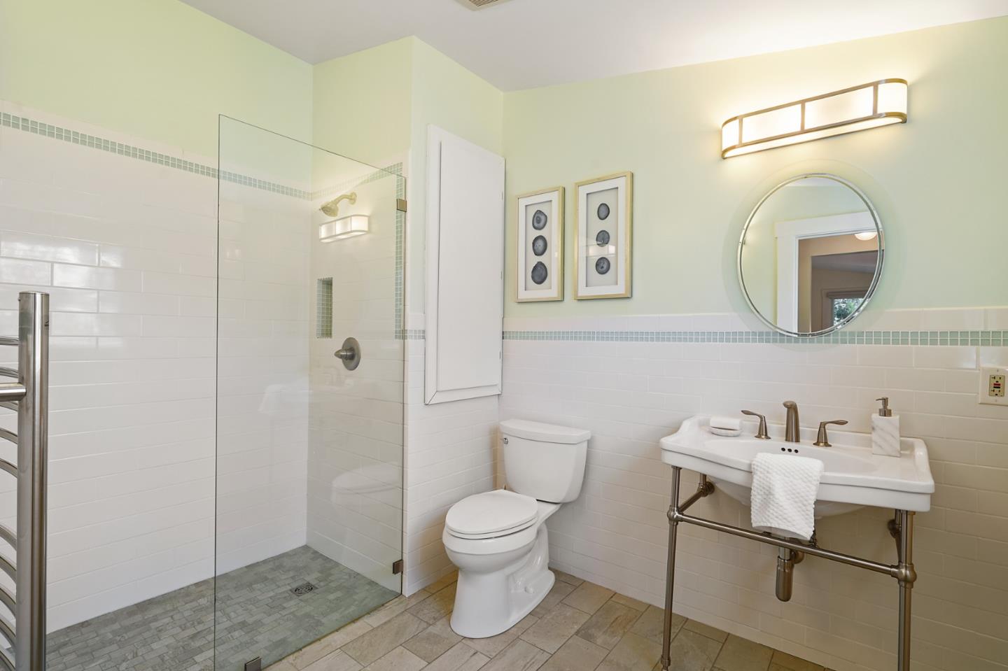 151 Melville Avenue Palo Alto, CA 94301 - Photo 25 of 51 a bathroom with a toilet a sink and mirror