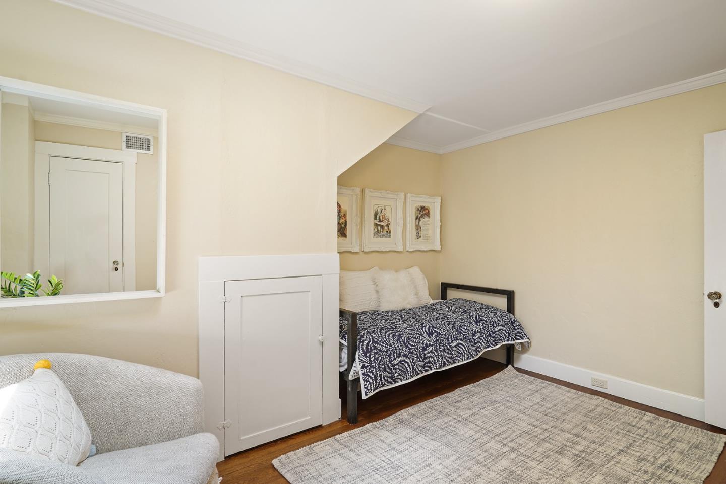 151 Melville Avenue Palo Alto, CA 94301 - Photo 36 of 51 a living room with a couch and dresser