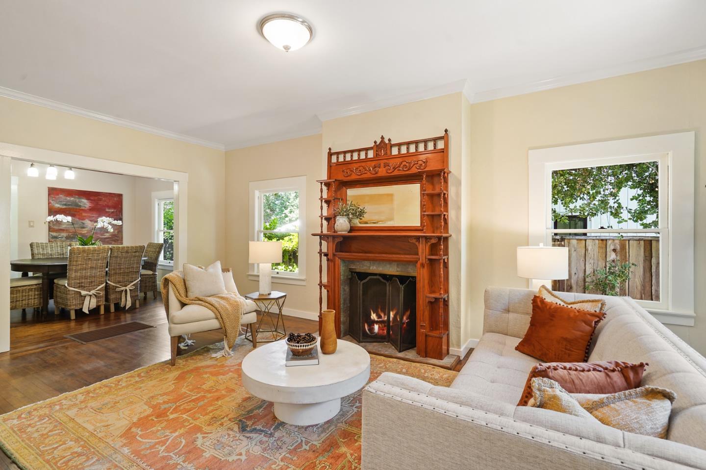 151 Melville Avenue Palo Alto, CA 94301 - Photo 4 of 51 a living room with furniture and a fireplace