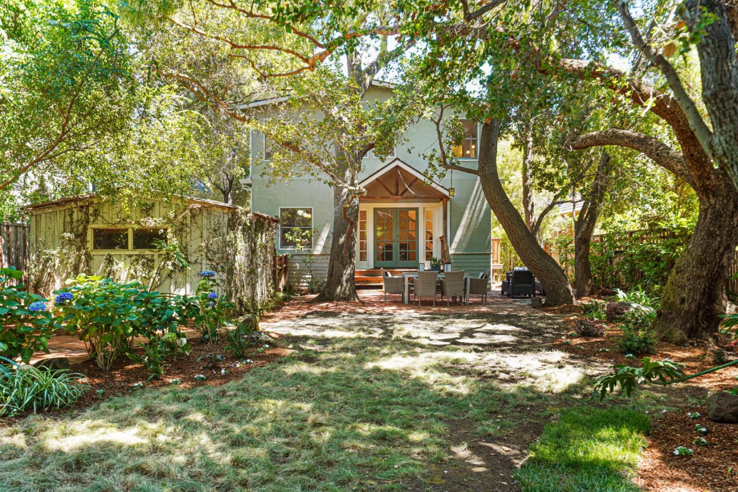 151 Melville Avenue Palo Alto, CA 94301 - Photo 47 of 51 a view of a house with a large tree and a yard