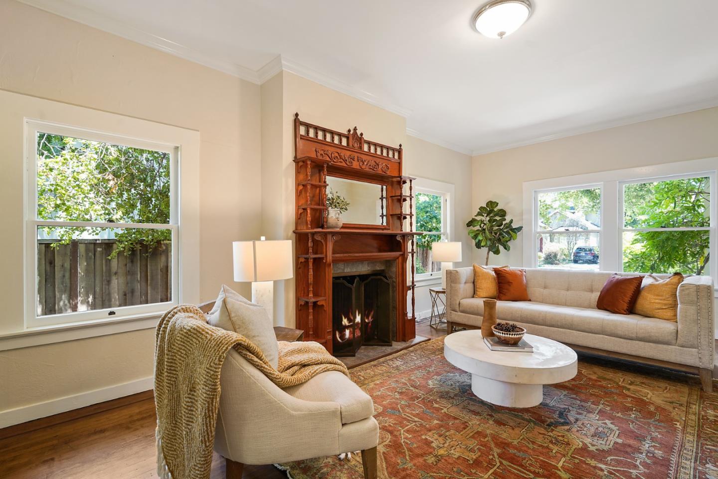 151 Melville Avenue Palo Alto, CA 94301 - Photo 7 of 51 a living room with furniture and a fireplace