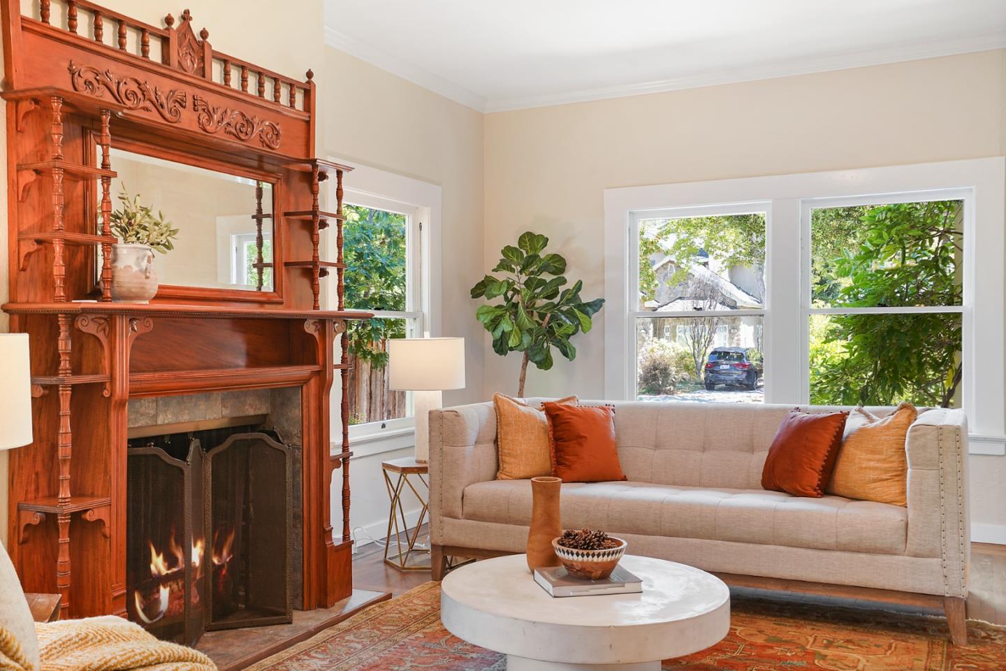 151 Melville Avenue Palo Alto, CA 94301 - Photo 8 of 51 a living room with furniture fireplace and a large window