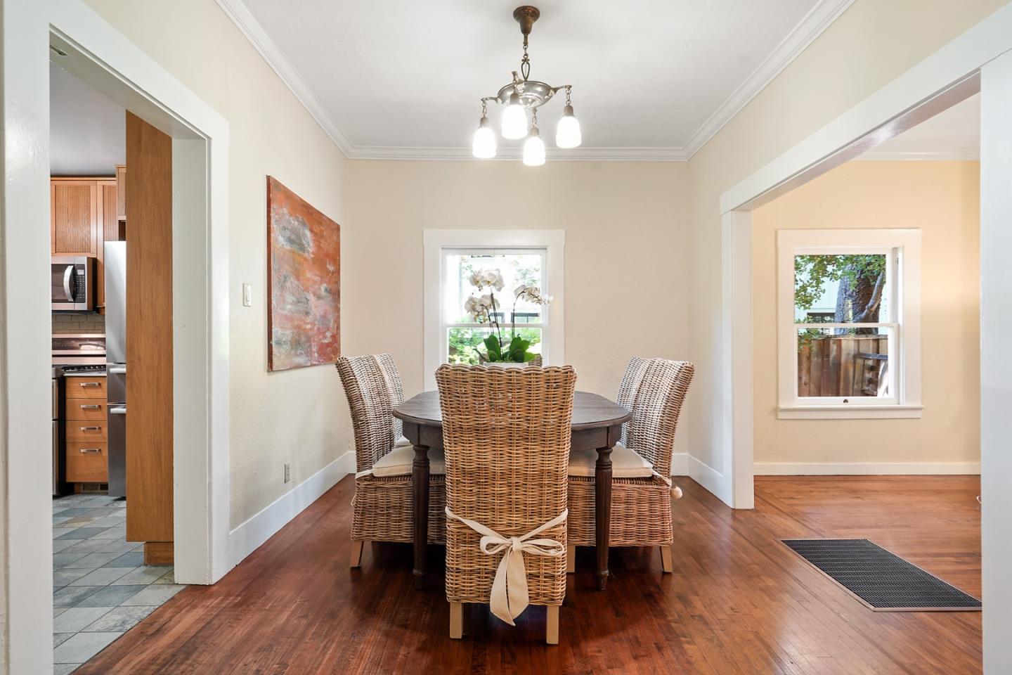 151 Melville Avenue Palo Alto, CA 94301 - Photo 9 of 51 a view of a dining room with furniture window and wooden floor