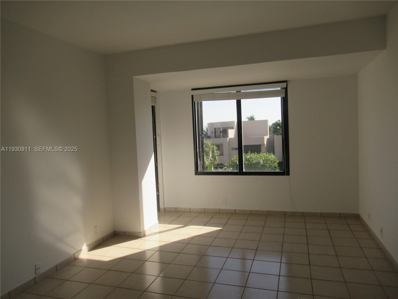 201 Crandon Boulevard, Unit 341 Key Biscayne, FL 33149 - Photo 12 of 25 a view of an empty room with a window