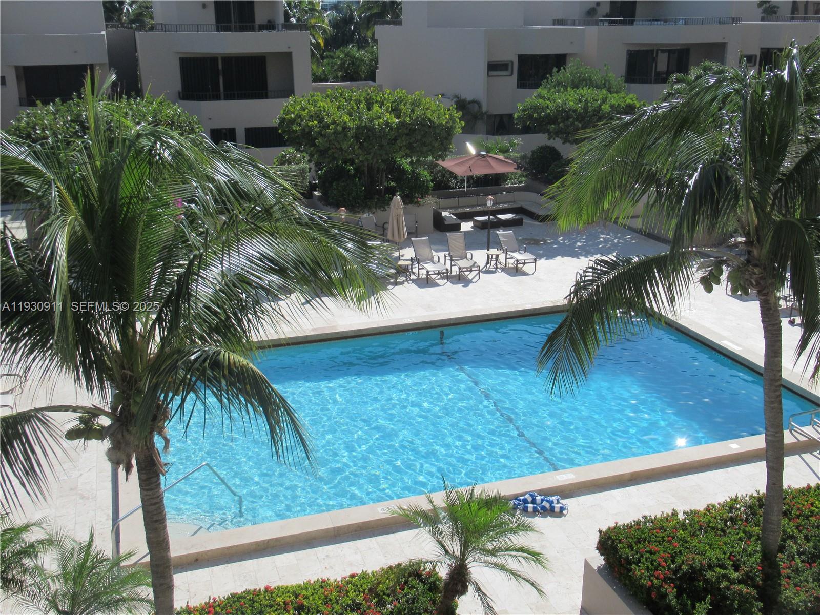 201 Crandon Boulevard, Unit 341 Key Biscayne, FL 33149 - Photo 3 of 25 a view of backyard with outdoor seating and plants