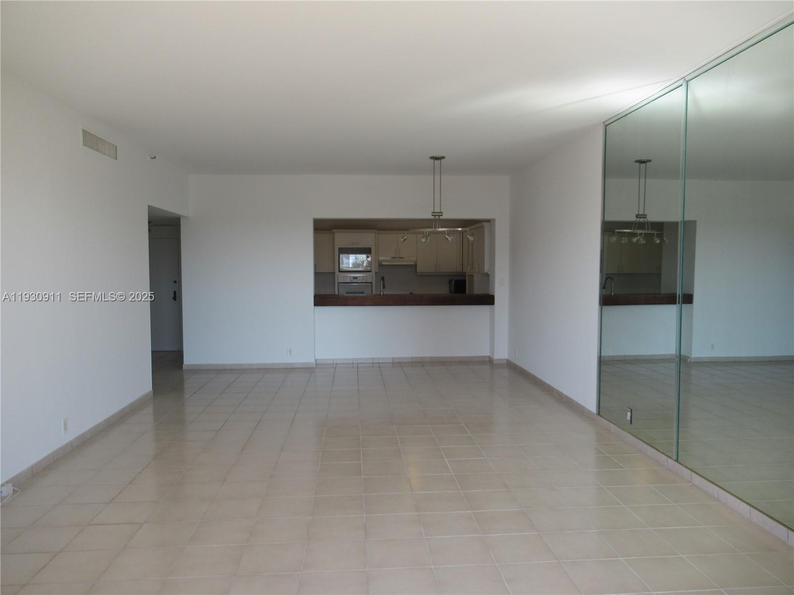 201 Crandon Boulevard, Unit 341 Key Biscayne, FL 33149 - Photo 4 of 25 an empty room with a bathroom