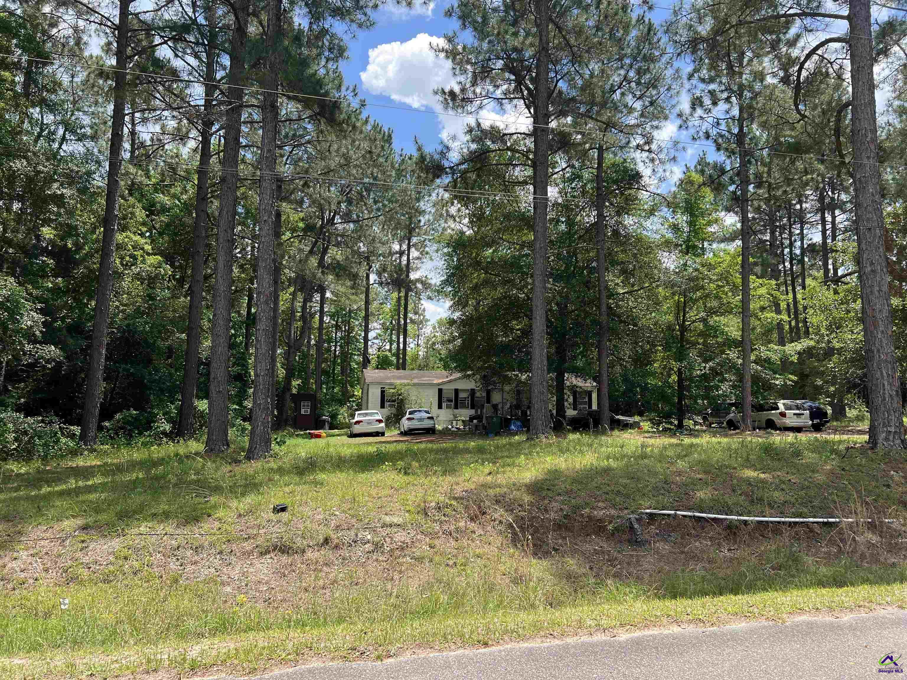 Rock Hill Road Cochran, GA 31014 - Photo 17 of 26 a view of a swimming pool with a house in the background