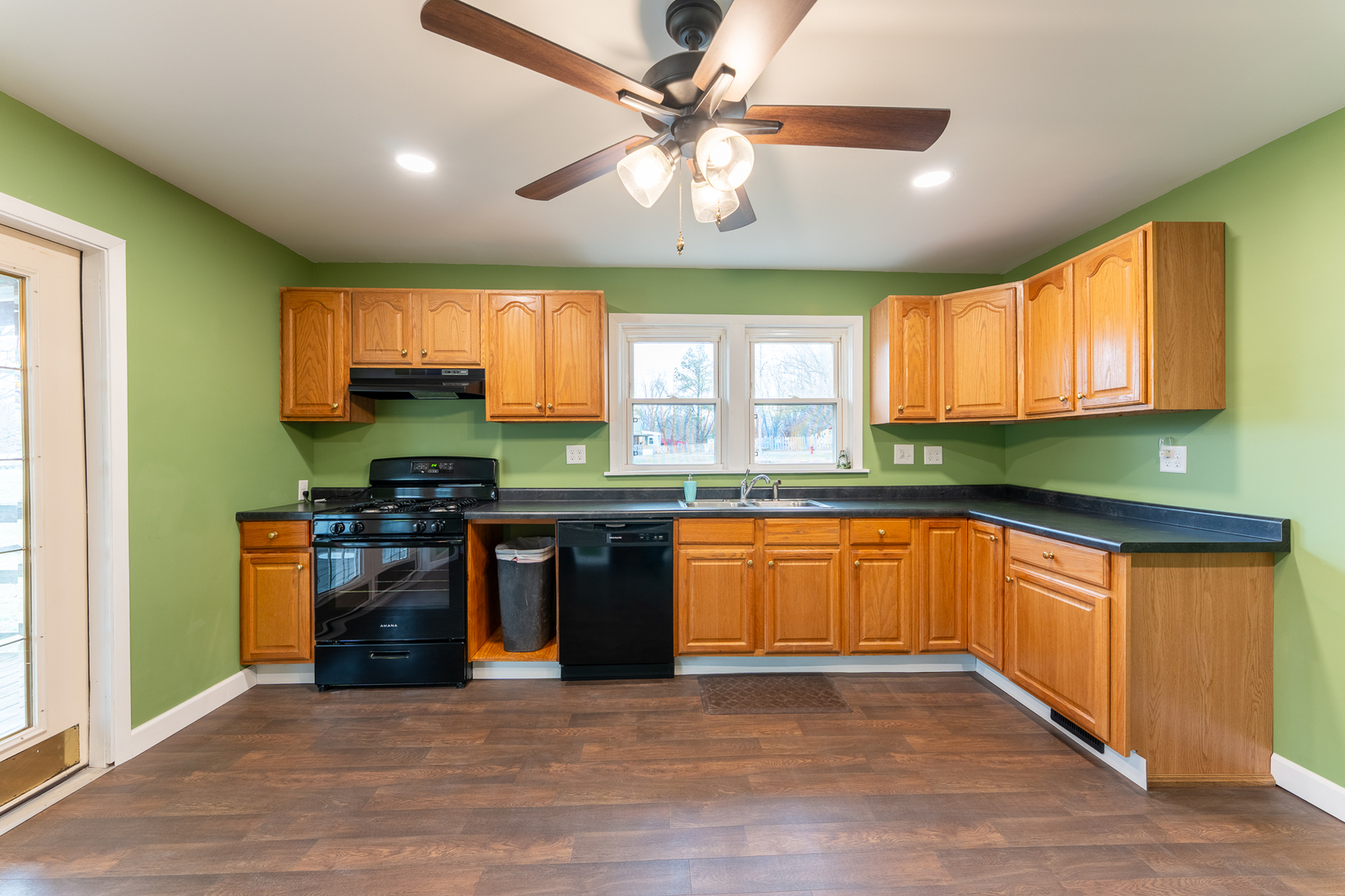 107 Seminary Street Creal Springs, IL 62922 - Photo 28 of 43 a kitchen with stainless steel appliances granite countertop a stove and a sink