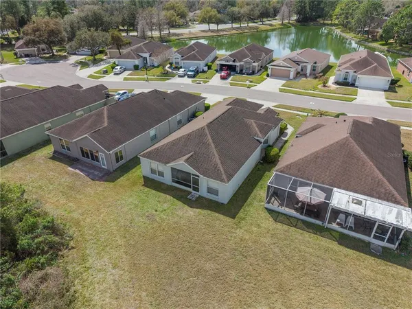 an aerial view of a house with outdoor space