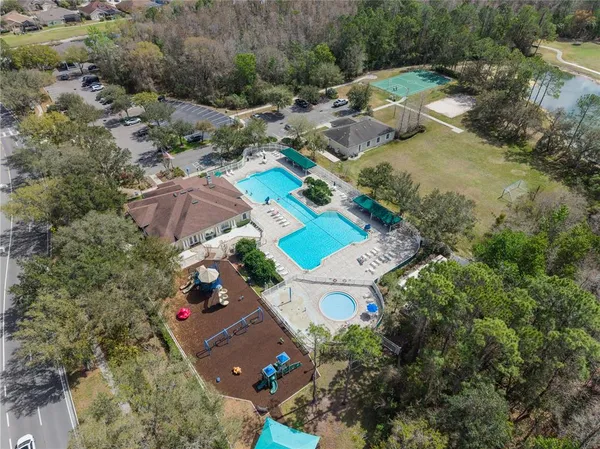 an aerial view of a house with outdoor space