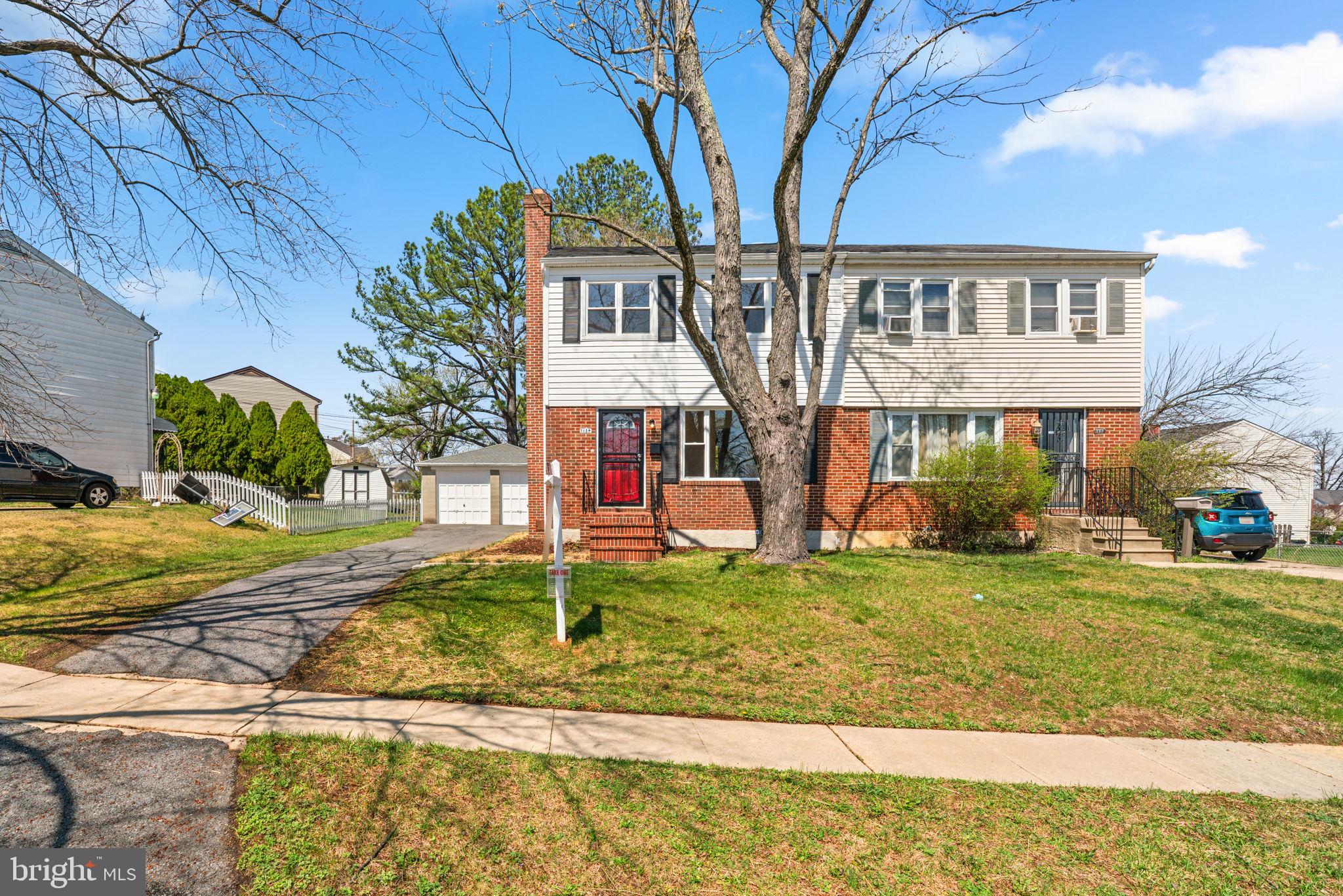 7134 Bexhill Road Windsor Mill, MD 21244 - Photo 1 of 34 a front view of a house with a yard