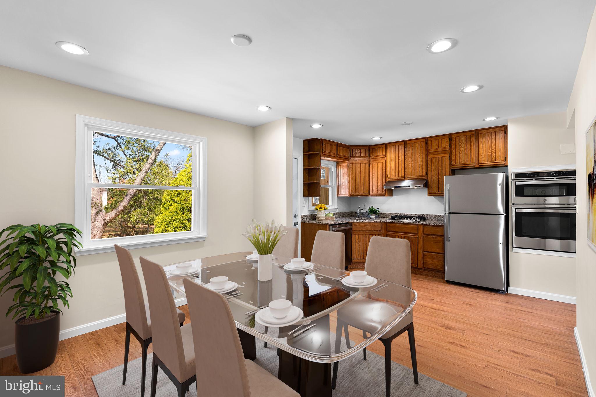7134 Bexhill Road Windsor Mill, MD 21244 - Photo 13 of 34 a dining room with furniture a window and kitchen view