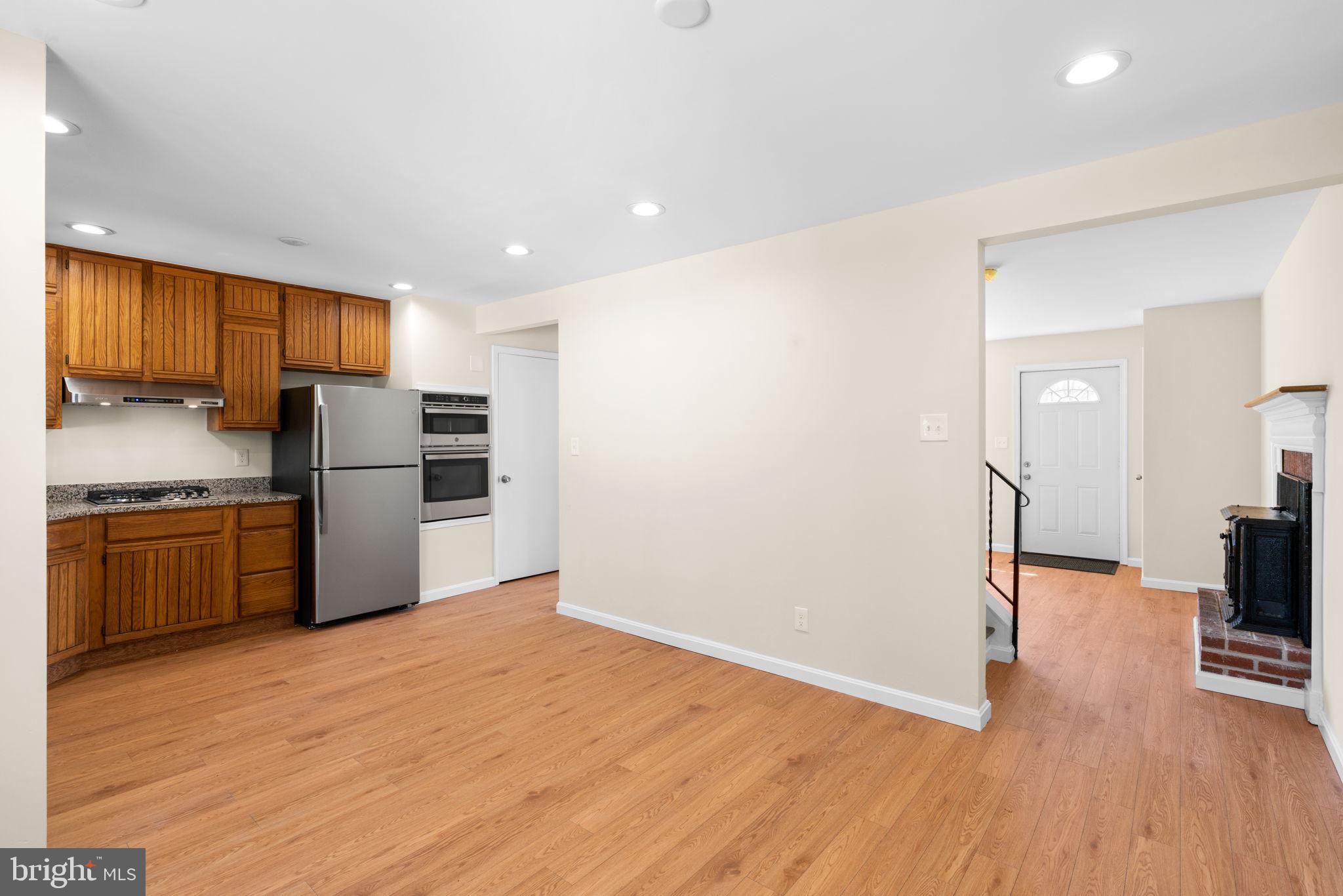 7134 Bexhill Road Windsor Mill, MD 21244 - Photo 16 of 34 a kitchen with stainless steel appliances a refrigerator and a stove top oven