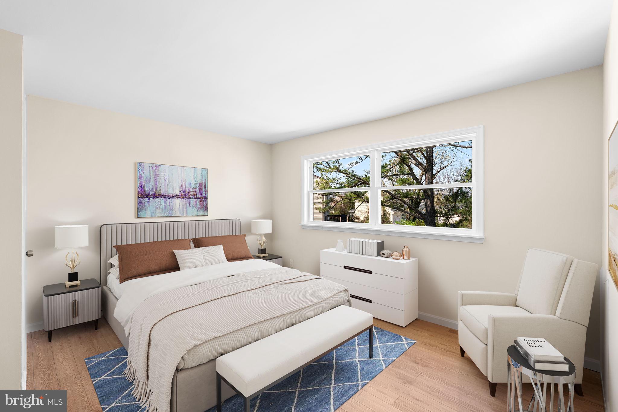 7134 Bexhill Road Windsor Mill, MD 21244 - Photo 17 of 34 a bedroom with a bed and a large window