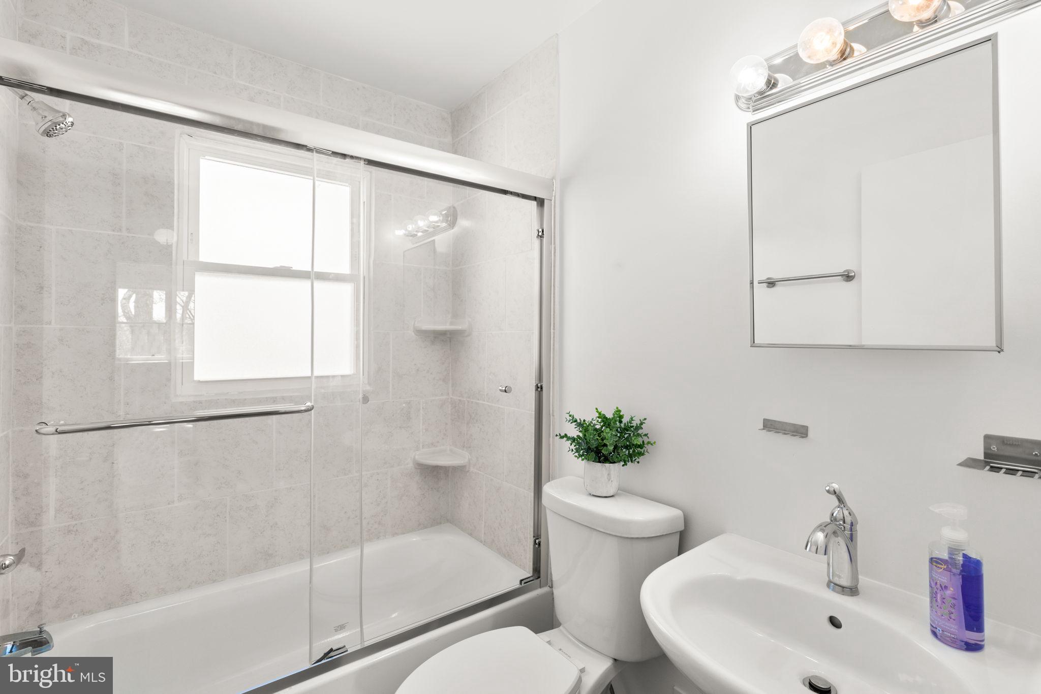 7134 Bexhill Road Windsor Mill, MD 21244 - Photo 20 of 34 a bathroom with a sink toilet and shower