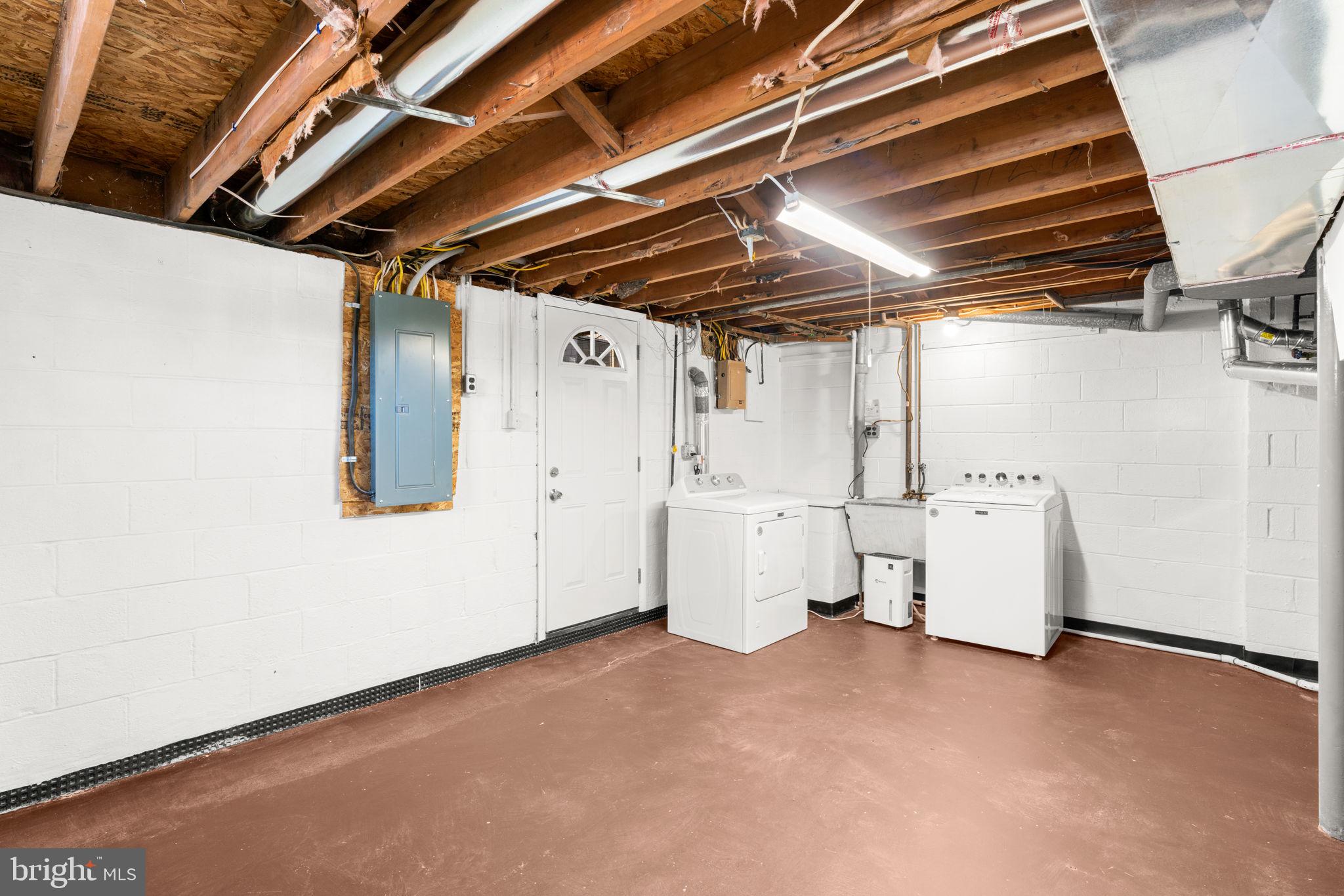 7134 Bexhill Road Windsor Mill, MD 21244 - Photo 29 of 34 a view of storage and utility room with racks