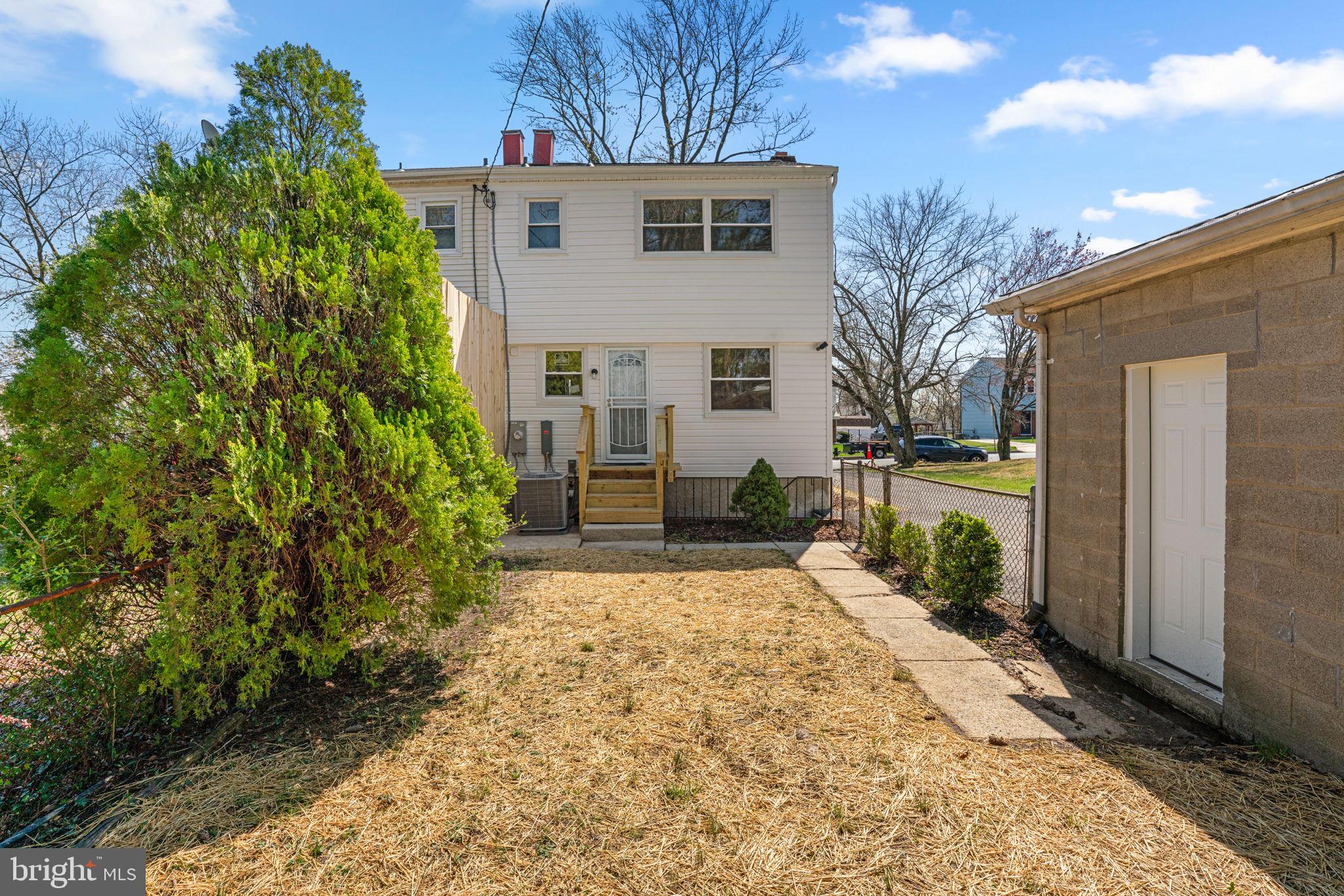 7134 Bexhill Road Windsor Mill, MD 21244 - Photo 31 of 34 a view of a house with a yard