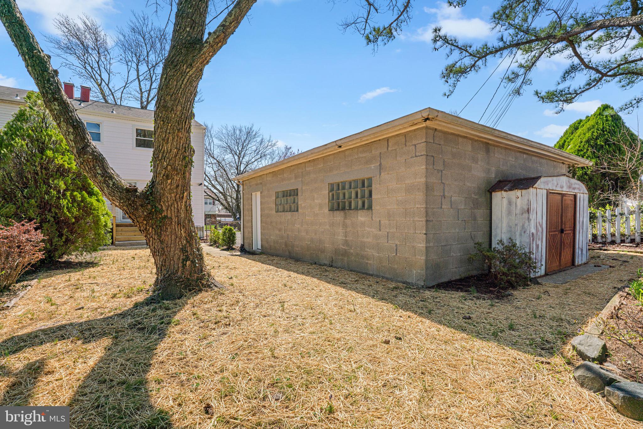 7134 Bexhill Road Windsor Mill, MD 21244 - Photo 33 of 34 a view of a house with a yard