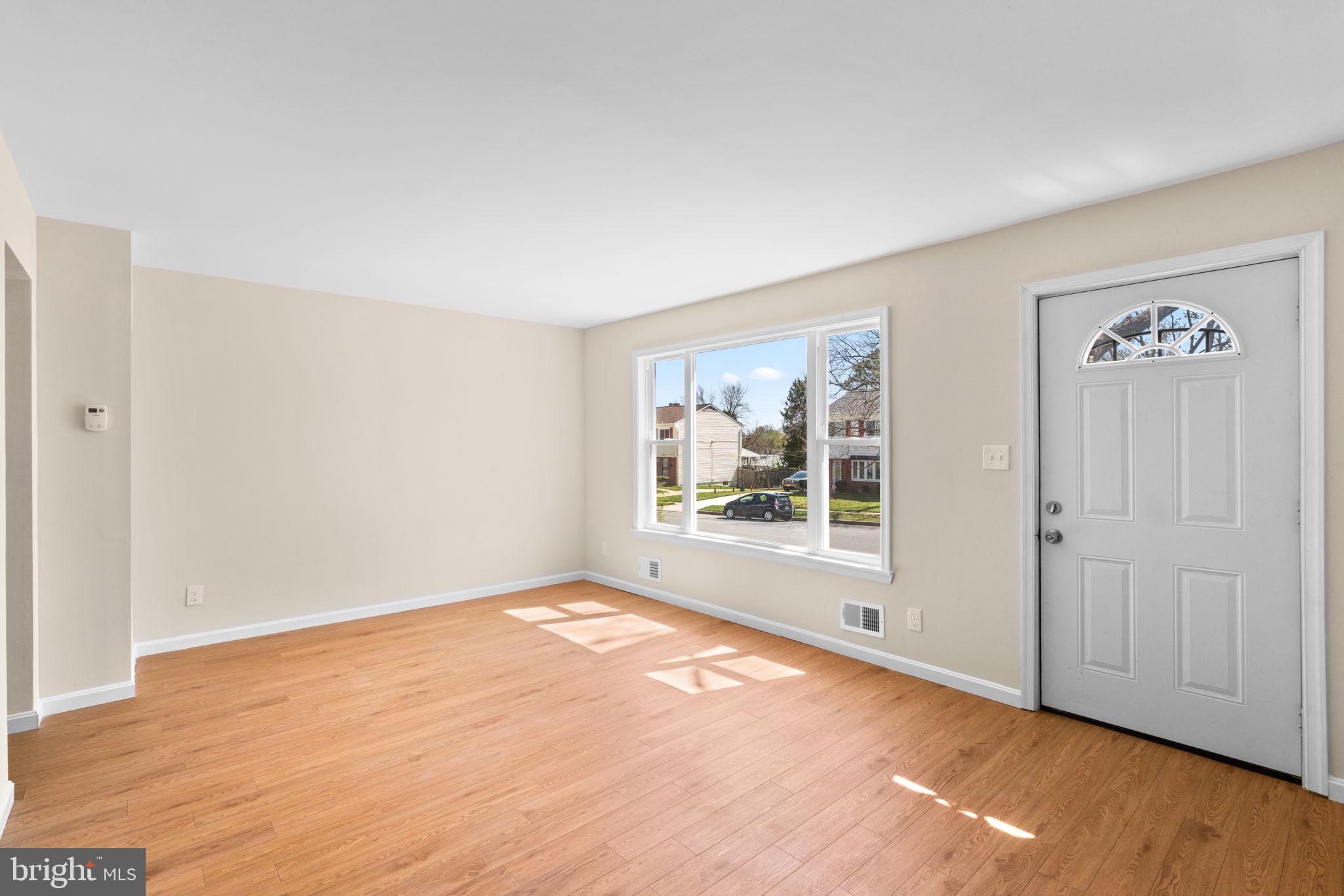 7134 Bexhill Road Windsor Mill, MD 21244 - Photo 4 of 34 a view of an empty room with a window