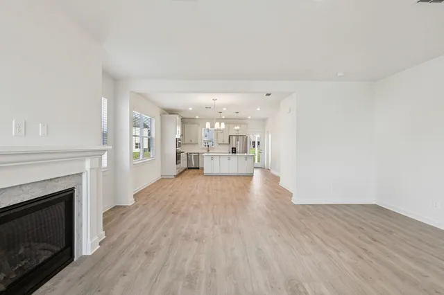 a view of a kitchen with furniture and a fireplace