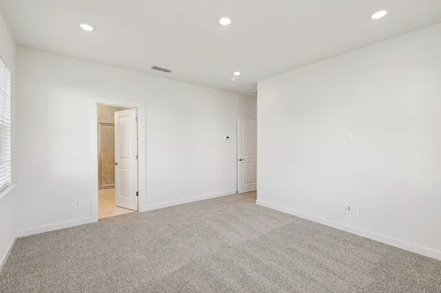 a bathroom with a shower sink and mirror