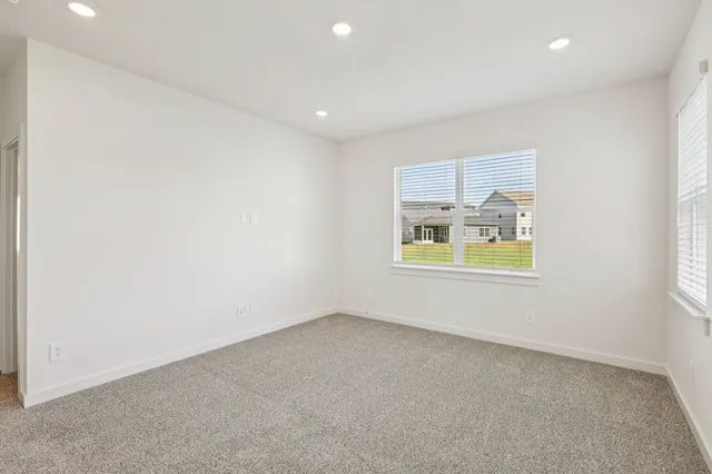 a bathroom with a granite countertop toilet and a shower