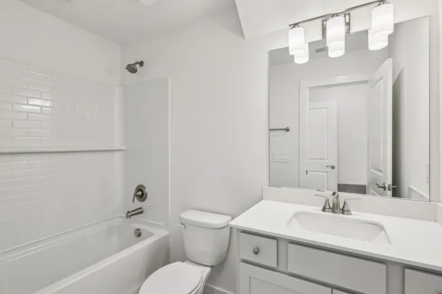 a view of an empty room and entryway