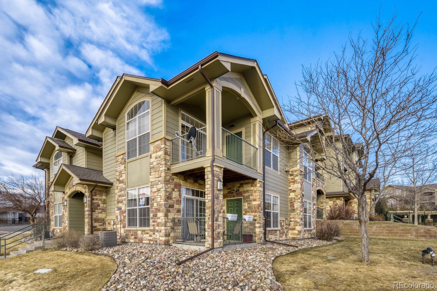 18611 Stroh Road, Unit 5108 Parker, CO 80134 - Photo 23 of 24 a front view of a house with a yard