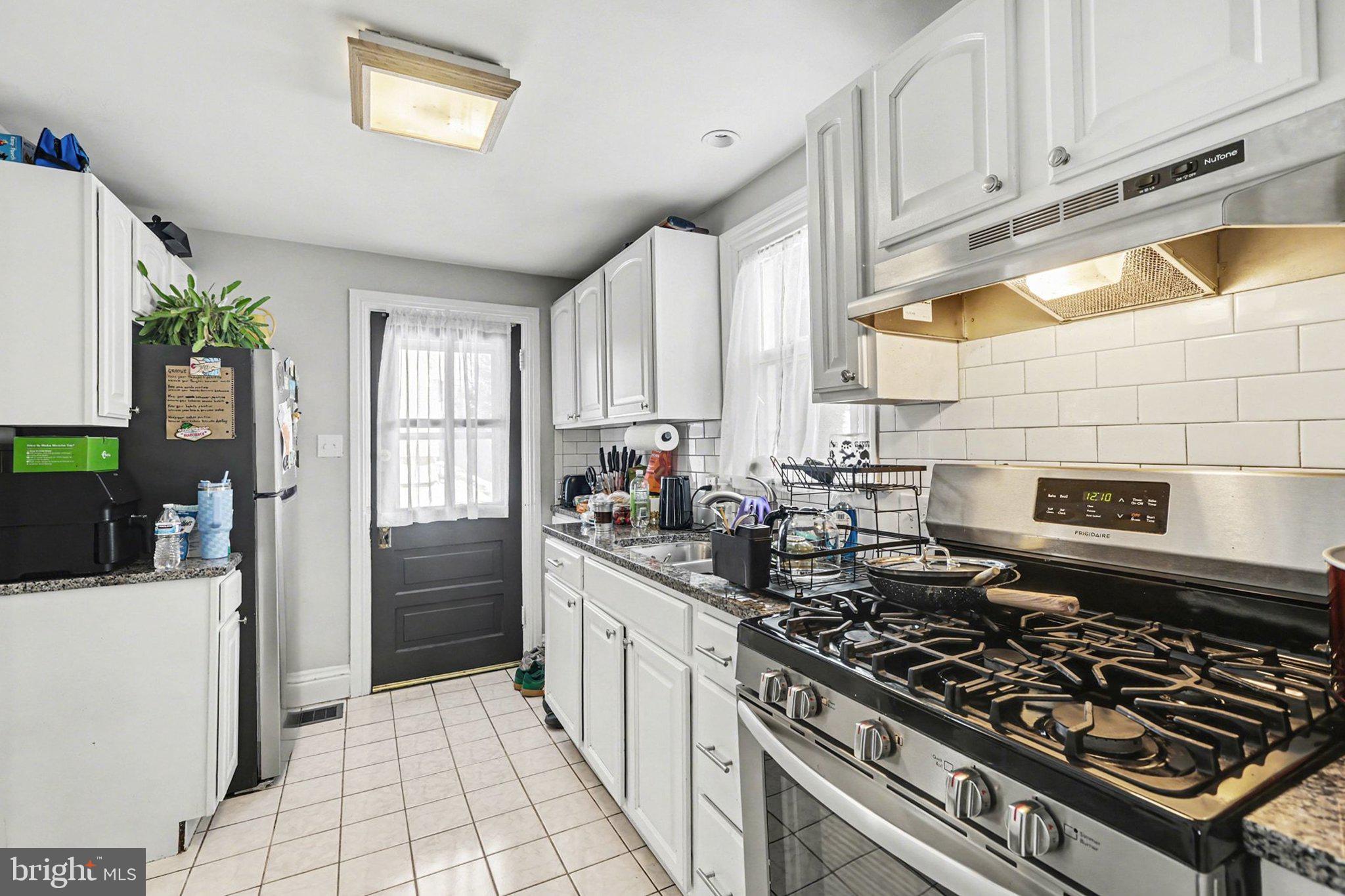 348 East Derry Road Hershey, PA 17033 - Photo 11 of 16 a kitchen with stainless steel appliances a stove a sink dishwasher and cabinets