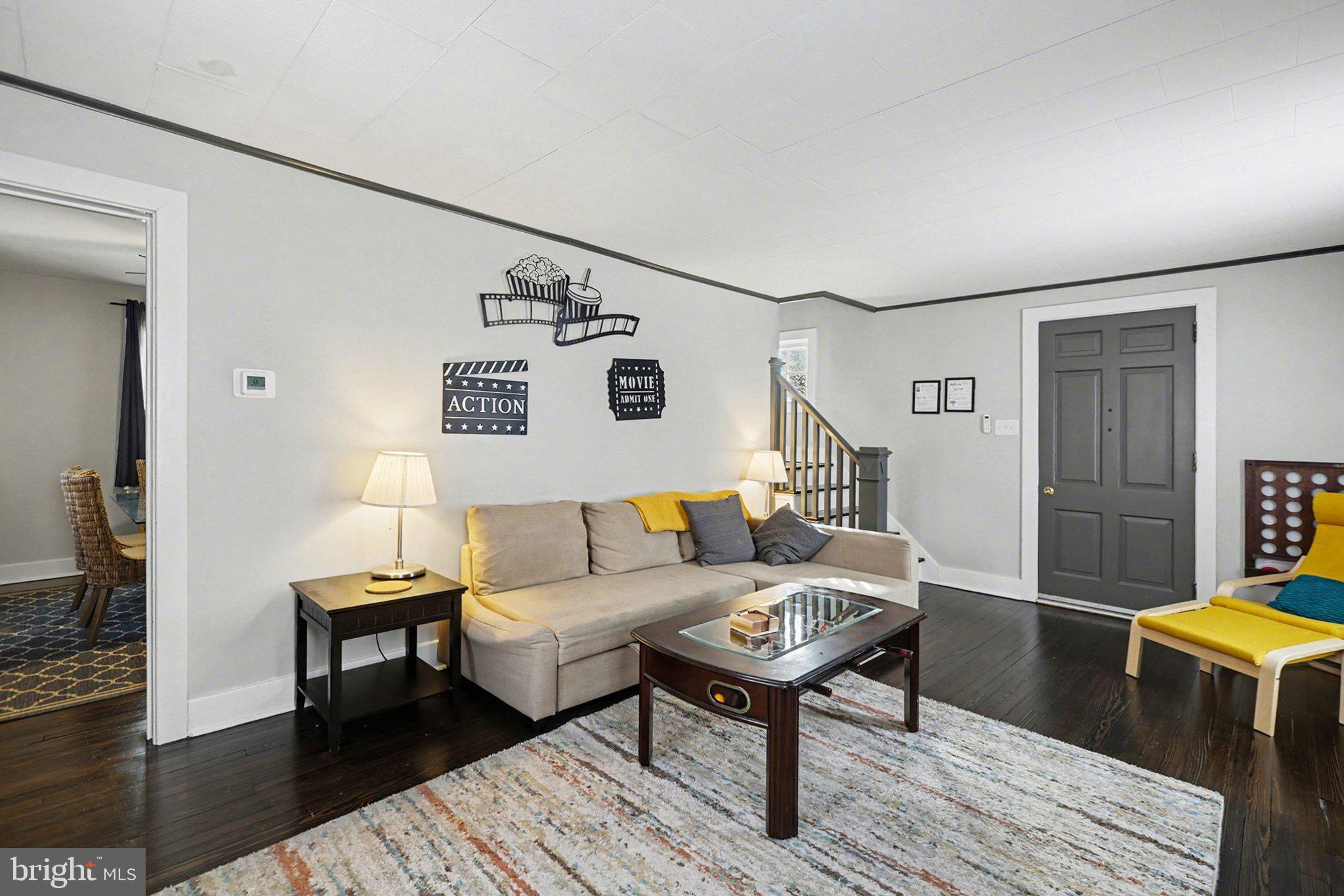 348 East Derry Road Hershey, PA 17033 - Photo 4 of 16 a living room with furniture and a wooden floor