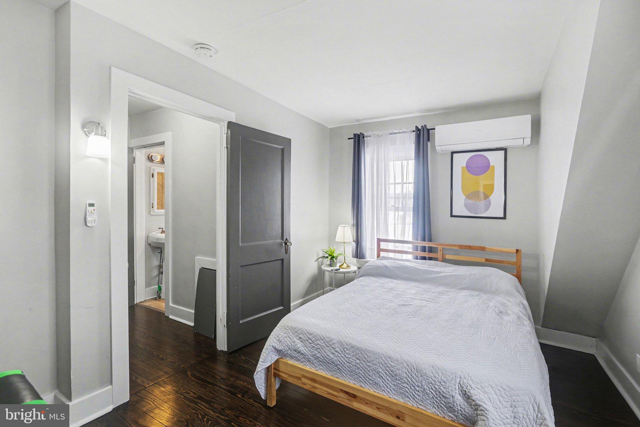 348 East Derry Road Hershey, PA 17033 - Photo 9 of 16 a bedroom with a bed and a painting on the wall