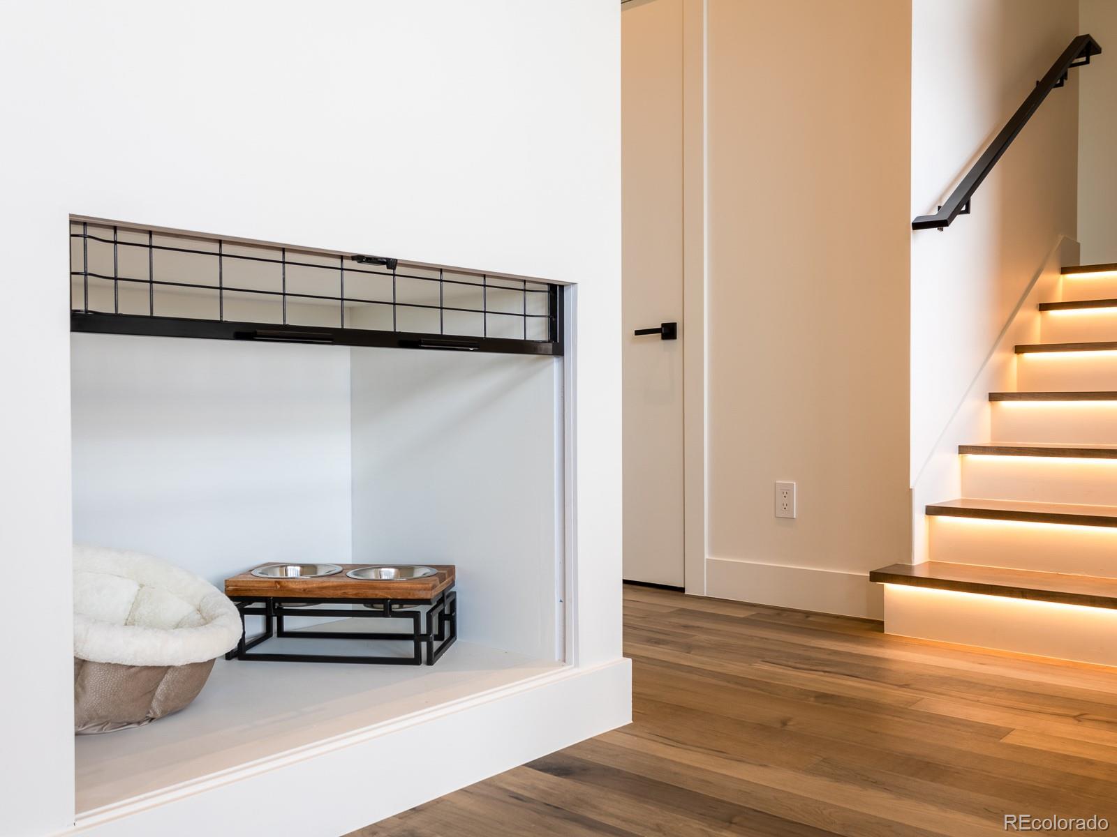 7526 Spring Drive Boulder, CO 80303 - Photo 19 of 40 a room with stairs and a wooden floor